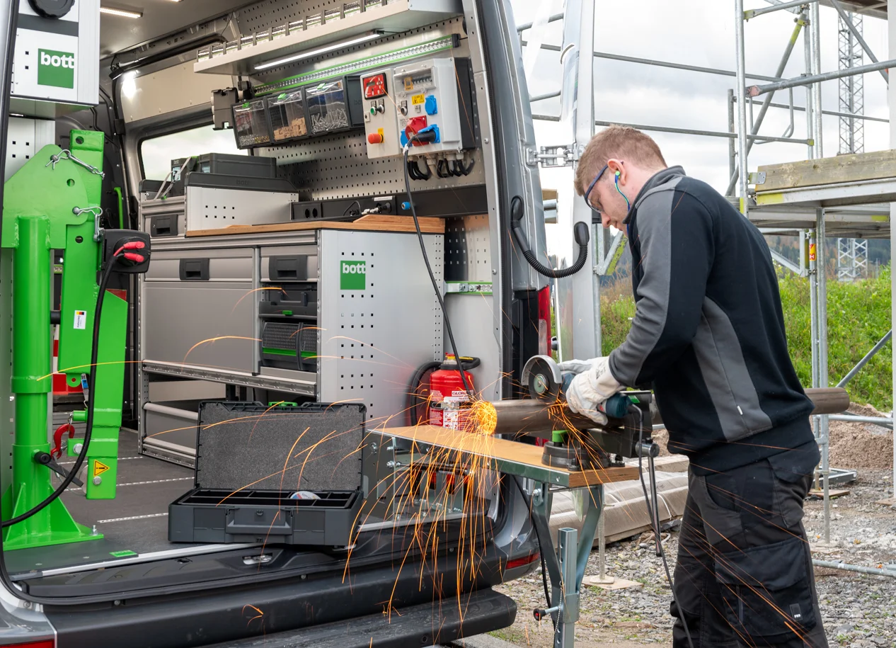 Professional using bott vario3 equipment inside a van