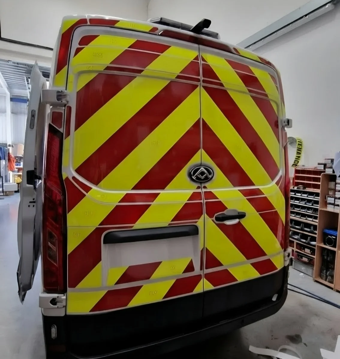 Detail of reflective chevron markings on a commercial vehicle