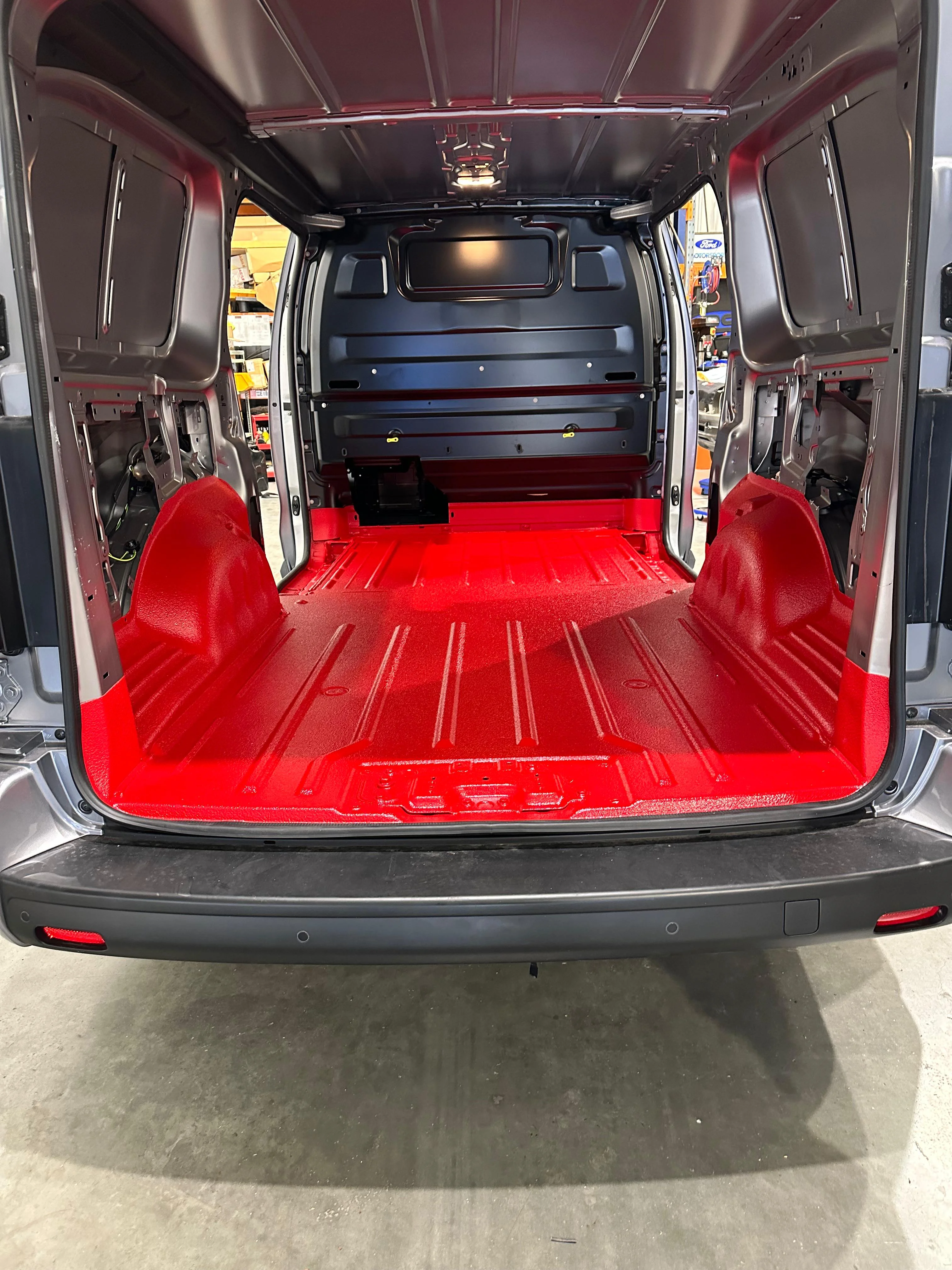 Speedliner protective coating being professionally applied inside a commercial van