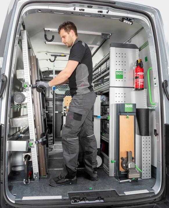 Vehicle racking being professionally installed inside a van